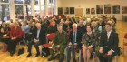 Salėje Vilniaus anykštėnai. Iš dešinės (1-oje eil,): Gediminas Grina, Regina Smetonaitė, Jonas Andriuškevičius, Valdas Šiaučiulis ir kt.